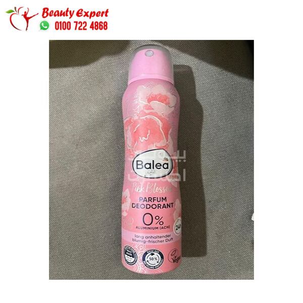 Pink deodorant spray bottle with 'Balea' branding on a gray surface.